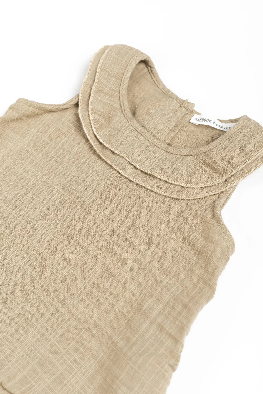 Sleeveless dress in mustard- side