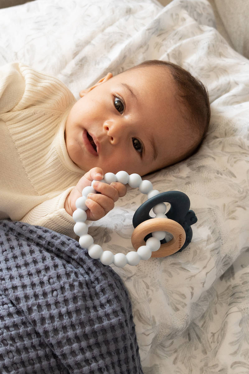 Wood Silicone Key Teething Ring Blue- baby holding